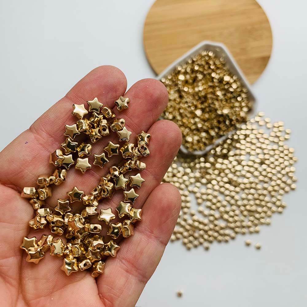 micanga estrela dourada 6mm Miçanga entremeio Estrela dourado 6mm- 25gramas- (aprox. 415unidade)